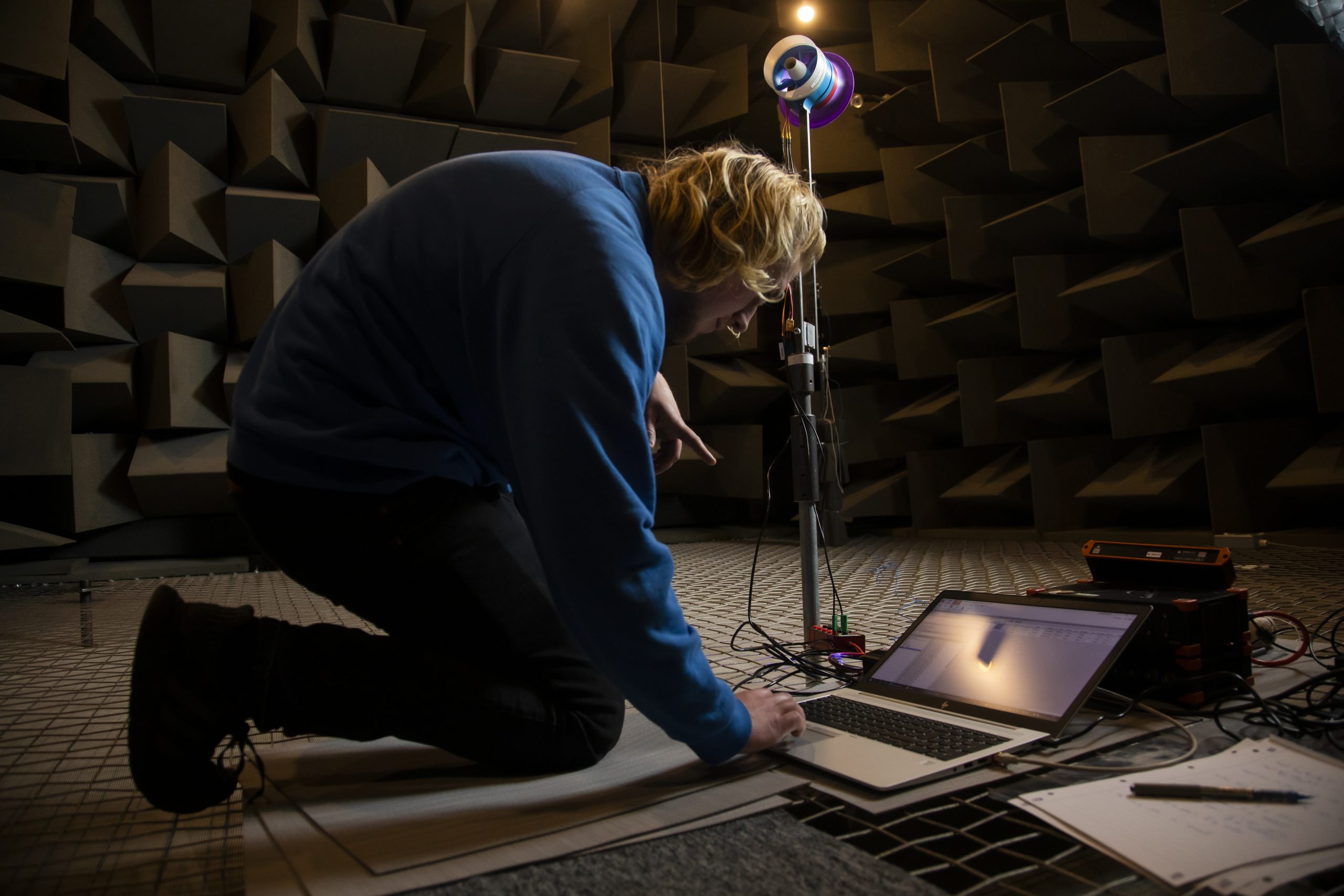 PhD Student performing a fan test in the anechoic chamber