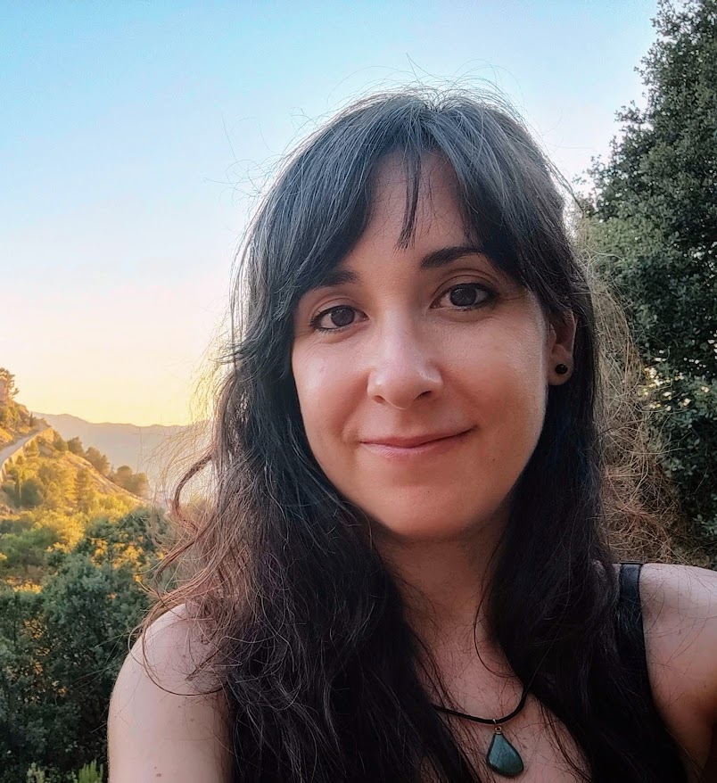 Photograph of Carmen Rosas-Pérez with a forest landscape in the background.